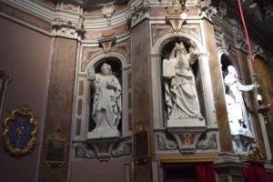 The statues on the right of the chapel