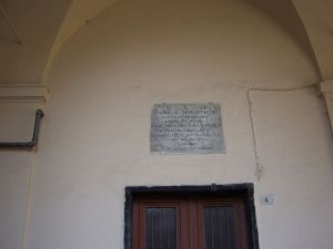 The plaque above the entrance door